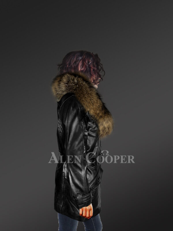 Long leather jacket in black for women with detachable raccoon fur collar with Model side view