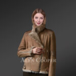 Brown Toscana shearling coat blending feminism with style