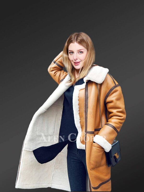 Womens stylish long coats made from genuine shearling pelts side view