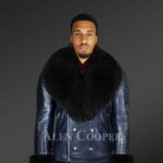 Black leather jacket with fox fur hood and handcuffs reinventing men’s fashion craze with model