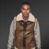 The Vintage finish Tan shearling vest Men serves as a perfect fit with wool detailing on the collar. Tan Shearling Vest Men