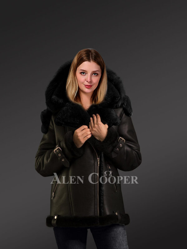 Sheepskin shearling jacket women is a light weight outwear in black detailing with black fur, hood and belts on Cuffs. Sheepskin Coat Jacket Women