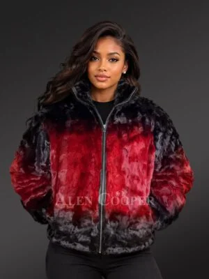 Make a confident statement in contemporary luxury with the Women Mink Moto Jacket by Alen Cooper, a striking interpretation of classic moto-inspired outerwear crafted with plush mink fur. Featuring a dramatic combination of rich red, black and smoky charcoal tones, this jacket delivers bold visual contrast while retaining the sophisticated texture and elegance associated with premium mink. Luxurious Mink Fur Construction The jacket features a beautifully plush mink fur construction with a soft, dimensional surface. The natural sheen of the fur enhances the depth of each color section, creating subtle tonal variations as the jacket catches the light. The rich texture gives the sporty moto silhouette an unmistakably luxurious character. Bold Red and Black Color Blocking A distinctive red and black color-block design defines the jacket’s personality. Vibrant crimson and ruby-red tones dominate the center, transitioning into deep black and smoky charcoal shades around the shoulders, sleeves and lower section. This gradient-inspired combination creates a dramatic visual effect while remaining sophisticated enough for elevated winter styling. Contemporary Moto-Inspired Silhouette The classic moto aesthetic is reimagined through luxurious fur and relaxed modern proportions. A structured stand collar gives the neckline a clean, contemporary appearance and can be styled higher for additional coverage. The comfortably voluminous sleeves and softly shaped body create an effortless silhouette that works beautifully with fitted trousers, jeans and streamlined separates. Full Front-Zip Closure A prominent full-length front zipper reinforces the moto-inspired character while offering practical versatility. Wear the jacket completely zipped for a sleek, structured presentation or partially open over a fitted black top for a more relaxed layered look. Functional Side Pockets Convenient side pockets are integrated into the design without disrupting the striking color-block arrangement. They add everyday practicality while preserving the jacket’s clean and luxurious appearance. Statement Luxury for Modern Styling The Women Mink Moto Jacket is designed for women who want their winter outerwear to feel distinctive, contemporary and luxurious. Pair it with fitted black trousers and boots for a dramatic monochromatic foundation that allows the red mink to command attention. Combining vibrant color, plush mink texture and a modern moto silhouette, this Alen Cooper jacket creates an exceptional balance between fashion-forward attitude and sophisticated cold-weather luxury. Key Features - Luxurious mink fur construction - Bold red, black and charcoal color blocking - Rich dimensional fur texture - Contemporary moto-inspired silhouette - Structured stand collar - Full front zipper closure - Functional side pockets - Relaxed full-length sleeves - Modern waist-to-upper-hip profile - Dramatic gradient-inspired color effect - Premium women’s statement outerwear